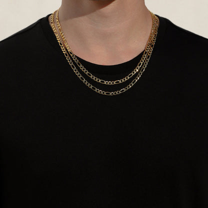Layered gold-tone Figaro chain necklaces, oval link pattern