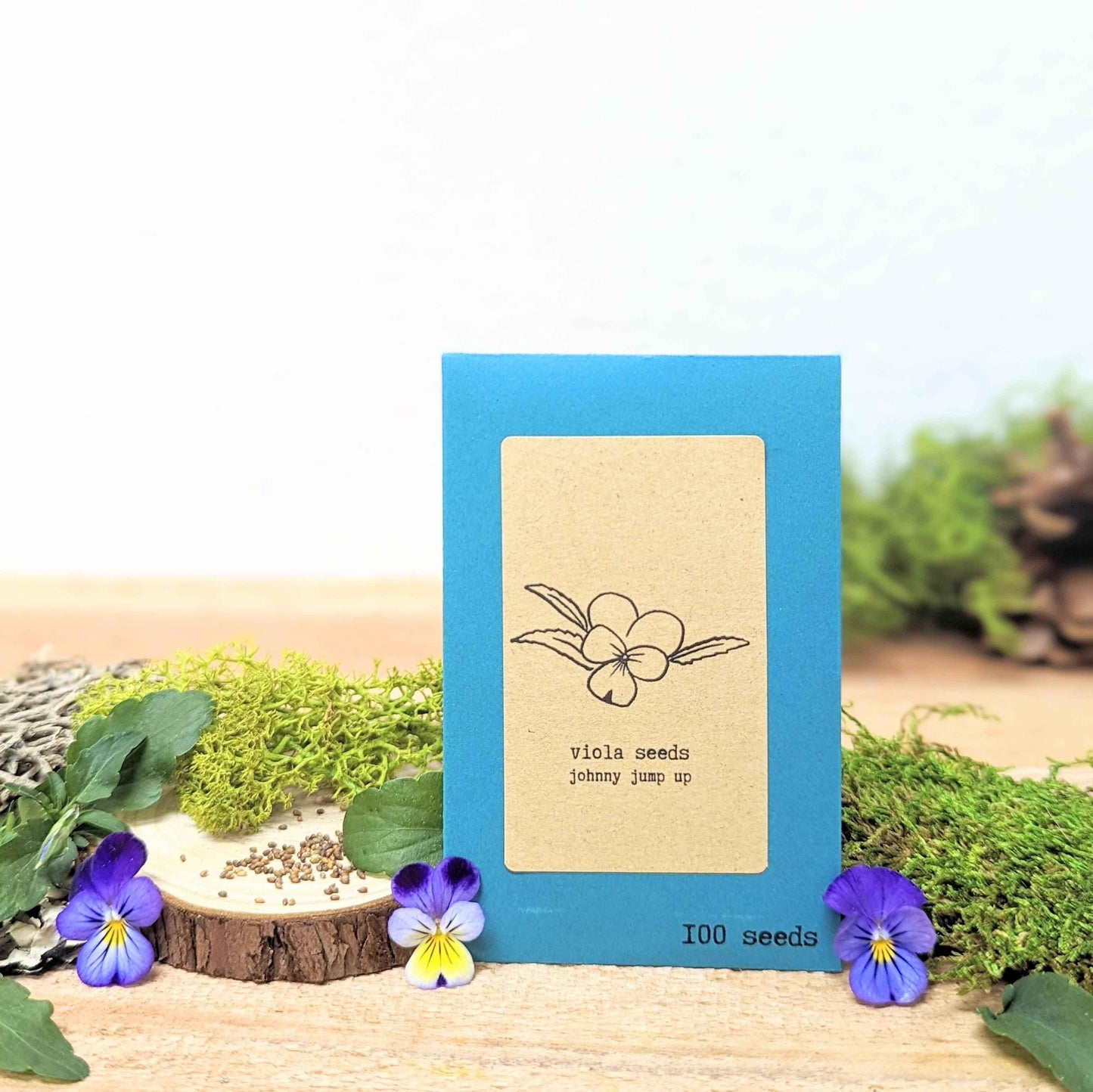 Viola Johnny Jump-Up seed packet, blue, 100 seeds; small purple pansies and scattered seeds