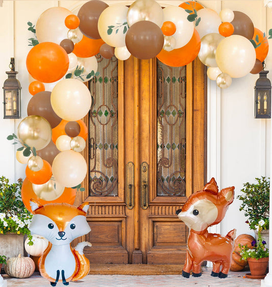 Woodland pumpkin balloon garland with fox and deer character balloons in orange and brown