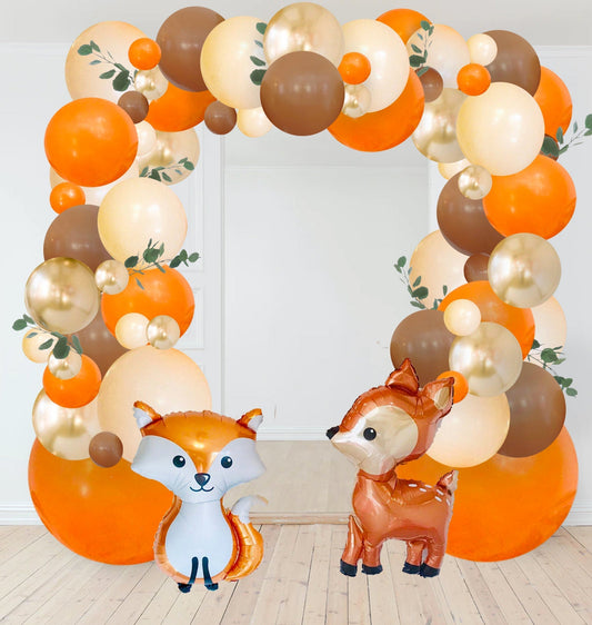 Woodland pumpkin balloon garland arch with orange, brown, white balloons and fox and deer balloons