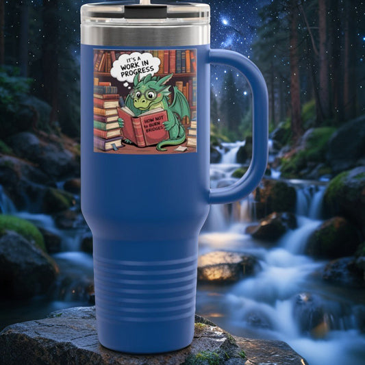40oz insulated travel mug in navy blue with book graphic and hinged lid, side handle.