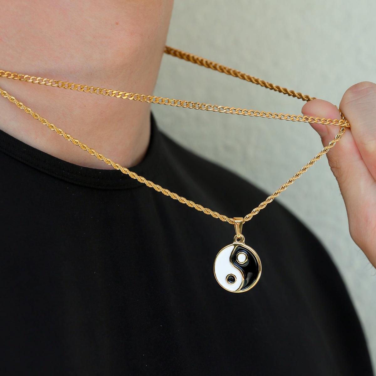 Layered gold chain necklaces with yin yang enamel pendant; black and white round charm